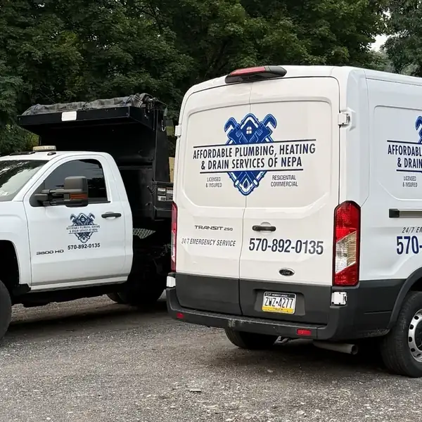Affordable Plumbing NEPA Chevrolet dump truck and Ford Transit service van