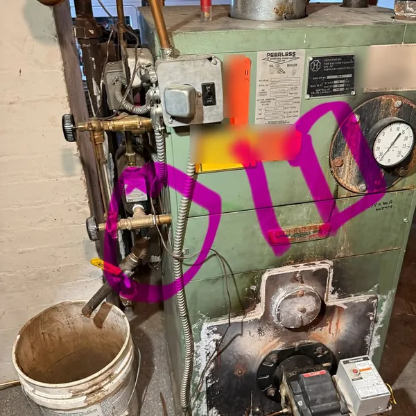 Old Peerless oil boiler before conversion by Affordable Plumbing NEPA