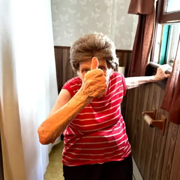 Ellie of Scranton giving a thumbs-up after her plumbing repair