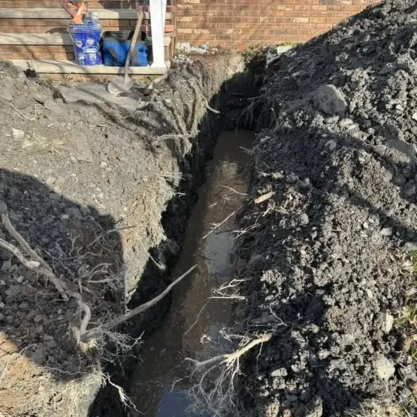 2. Open trench exposing the damaged underground water line by Affordable Plumbing NEPA