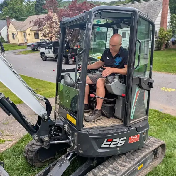 4. Owner Jerry Riviello operating the excavator by Affordable Plumbing NEPA