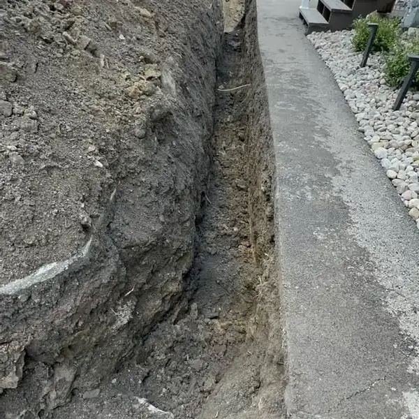3. Trenching through dense stone conditions by Affordable Plumbing NEPA