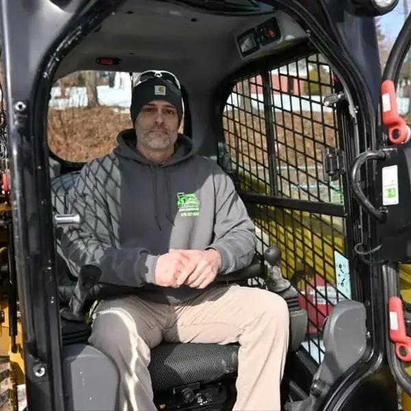 Jerry Riviello operating Caterpillar skid steer equipment